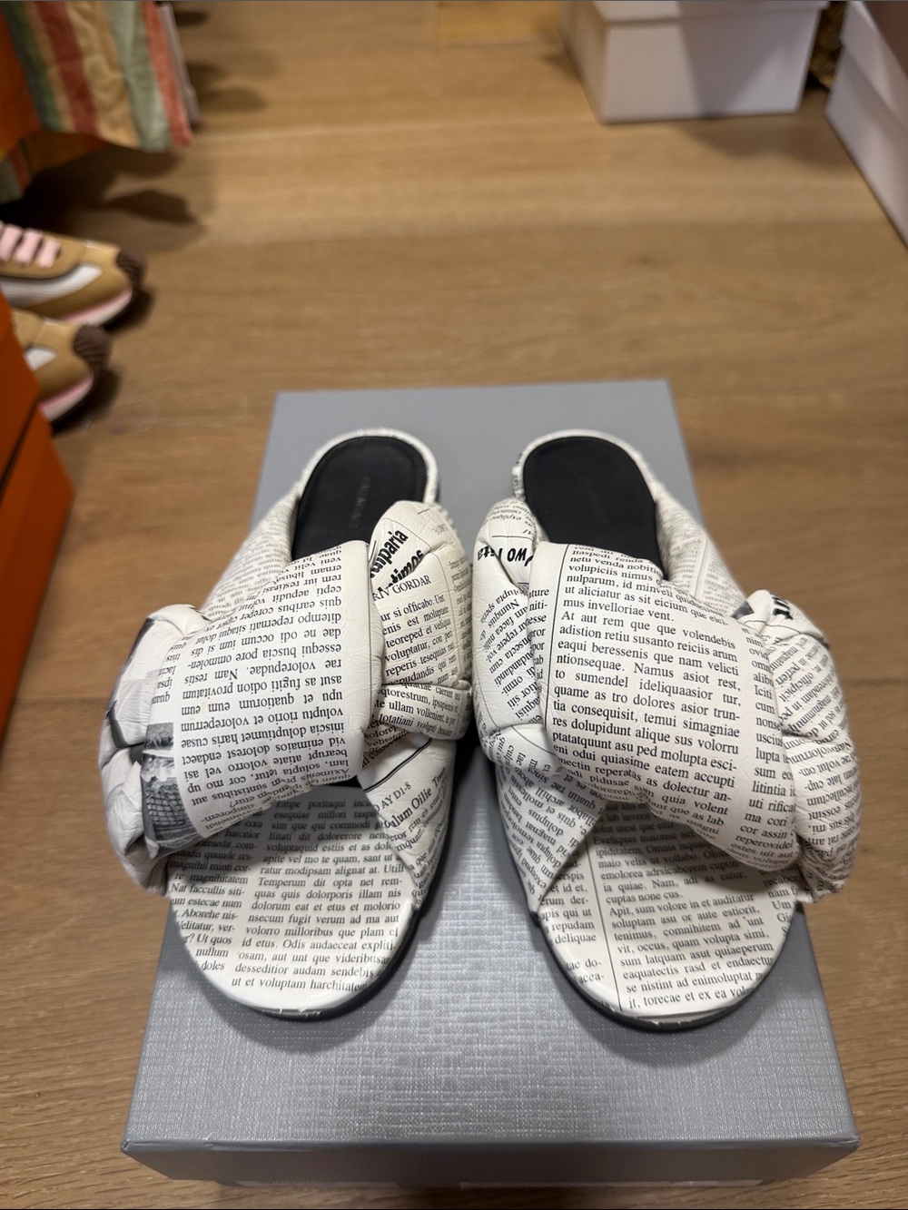 Balenciaga  Newspaper-Print Knot Slide Sandals in White and Black